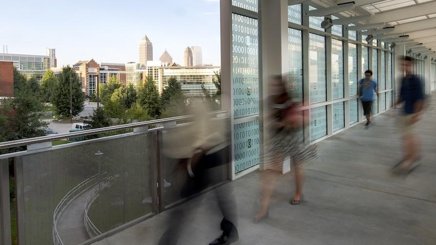 photo of people walking on bridge