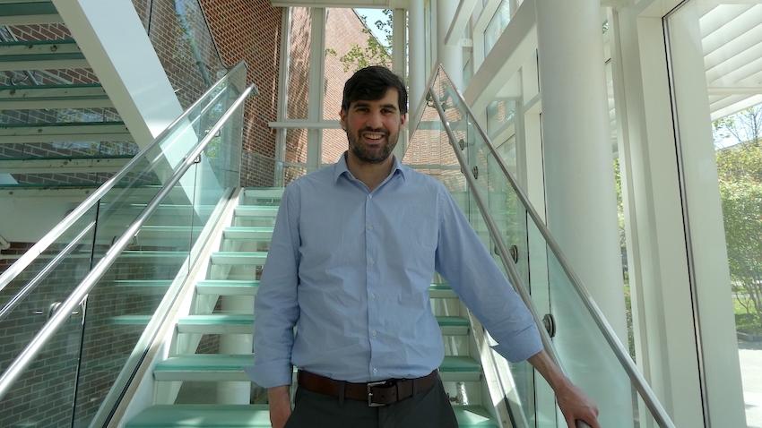 Man standing in stairway. 