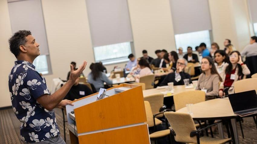 man speaking at podium